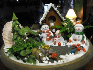 This one even includes a tree with a present. And it's mostly covered with snow (which is fake naturally).