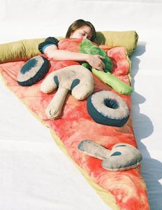 I'm sure anyone who loves the great outdoors would want to sleep on a slice of pizza with plush toppings of broccoli, mushrooms, and olives. Available on Etsy for $200.
