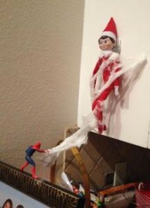 Because he just got caught in Spider Man's web. Great work, Spidey. The Elf on the Shelf needed to go.
