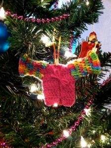 Because her sweater is simply amazing. Just have to love the colors on those sleeves.