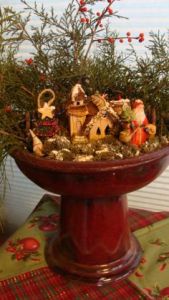 This one uses decor that's in a similar style. Yet, Santa seems bigger than this house.