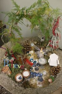 Not sure what I think about the tree. But I do think the shiny holly berries make a nice touch.