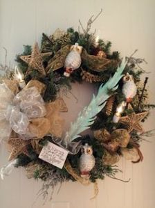 This one has owls, stars, quill, and a scroll with writing. Certainly a Harry Potter Christmas wreath if there was one.