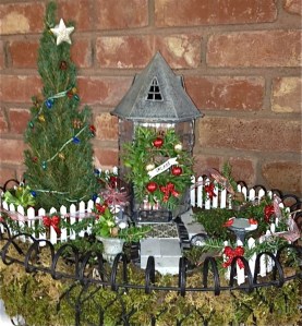 This one has a tower decorated with a wreath and garlands. Also like the tree.