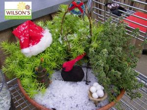 This one also has a pile of snowballs and red ribbons on the archway. Simple but lovely.