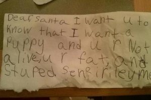 This kid doesn't seem very happy. Yeah, please rub it in Santa's face, how could you?