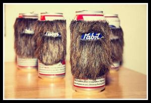 From Divine Secrets of a Domestic Diva: "I don’t even know what to say about this 1st place winner of the 2012 PBR Craft Show, so I’ll just tell you what amazon says…Give your favorite brew a manly mane of (facial?) hair with the Beard Koozie. Made from crafting fur that’s mounted to a stretchy band for maximum beer container compatibility, they feature a “mouth” opening to let a portion of the label shine through, and will instantly make you the coolest drunk at the party. I’m not sure there’s ever going to be a burlier – or funnier – way to drink a beer."