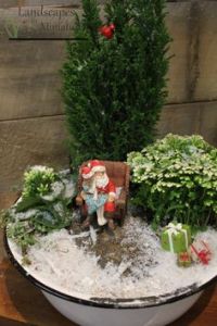 Yes, this one has a girl on Santa's lap. And she's not wearing a coat in the snow at all.