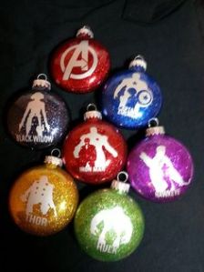 Each Avenger silhouette is in a respective color. And one includes the Avengers logo.