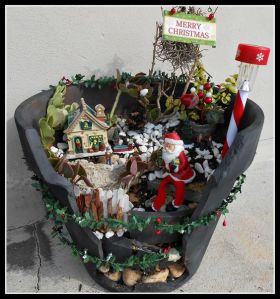 And Santa seems to be bigger than that house. And so does the North Pole.