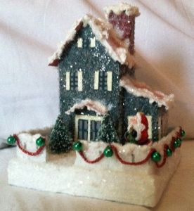 It even has green jingles with red beads as well as Santa in front. Love the shutters.