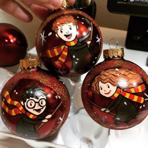 These baubles depict Harry, Ron, and Hermione on broomsticks. Got to love these.