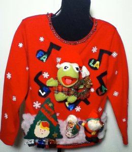 He's even singing to "Deck the Halls." Love how he's wearing plaid and a Santa hat.