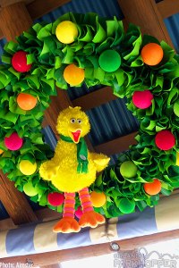 Just a green rag wreath with pom poms. Like seeing Big Bird with a scarf.