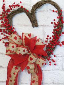Well, the berries are fake and sure aren't holly. But they'll do. Love the hearts on the bow, too.