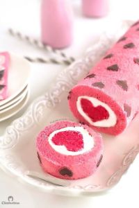 Yes, it's another cake roll. But this one is pink with chocolate hearts. And it has a darker pink heart in the center.