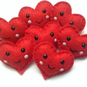 Each one has s smile and blushing cheeks. Many are used for pins. So cute.