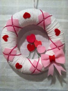 Well, it's a lovely wreath of white and pink. But most of the hearts are red.