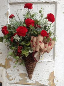 Though the flowers are fake and used as a front door bouquet decoration. Still, if you don't want a wreath, this will certainly do.