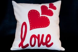 Doesn't hurt that it has some hearts stitched on it, too. Though not sure about having the letters in cursive.