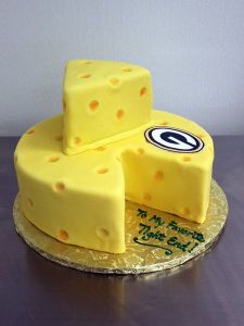 I'm not sure if it's a real cheesecake. But it's shaped like a cheese to any Packer fan's delight.