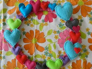 On this wreath, you'd find hearts of all kinds of colors and sizes. For those who aren't fond of pink, this is for you.