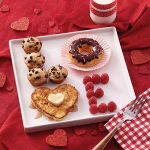 This one consist of muffins, a donut, a pancake, and raspberries. But it all spells, "Love."