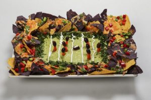 The nachos on these a have peppers and cheese on them. The dip is guac.