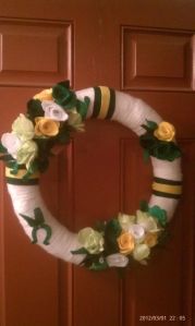 This one has green, white, and yellow flowers to match as well as a horseshoe. Lovely.