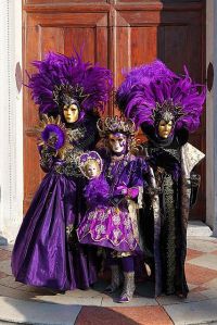 After all, these 3 are dressed in similar garb. And are wearing similar masks. Love how they're decked in purple.