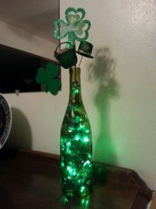 I'm sure a green wine bottle isn't hard to find among your recyclables. Though I love the shamrock touch.