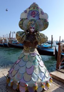 This woman has puffed sleeves, a hoop skirt, and a fancy headdress. How she keeps her head up, I don't know.