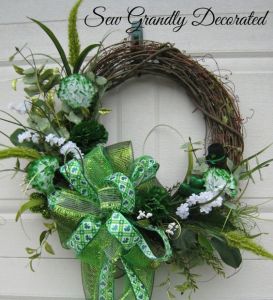 Another one with fake green flowers along with green ribbons. Wouldn't mind having this on my front door.