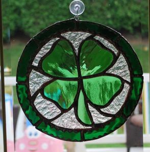 Contains a stained glass 4-leaf clover for the sun to shine through. Love it.
