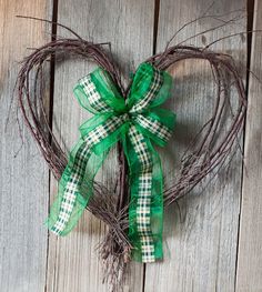 This one only entails a heart shaped wreath and a green ribbon. Great to put in any home.
