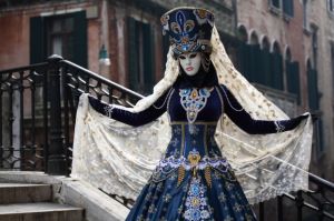Well, this is quite stunning. Love the peacock blue dress. But the headdress really makes the costume.