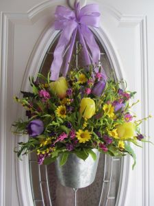 Well, it doesn't just have tulips. And the flowers are fake. But it'll certainly give a spring touch. Love the lavender ribbon.