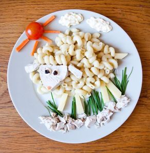 Because a sheep's fleece is always curly. Love how it has a cheese head with some veggies as the grass and sun.